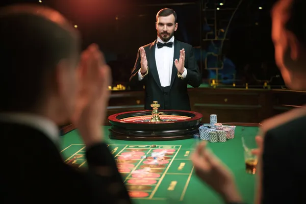 A glamorous woman holding casino chips in a neon-lit environment, representing the premium online casino atmosphere of JILI7979.
