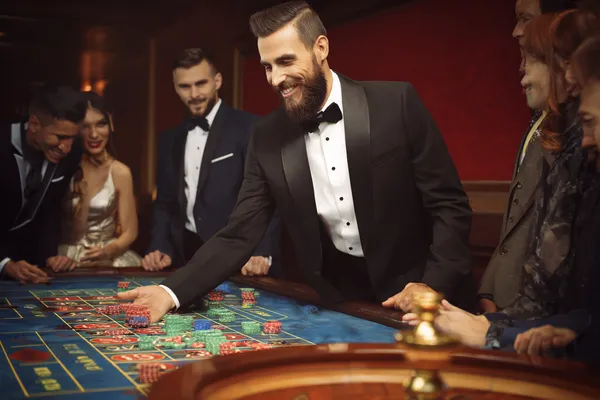 A close-up shot of golden coins falling around a spinning roulette wheel, representing immersive casino action at JILI7979.